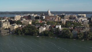 DX0002_160_031 - 5.7K aerial stock footage approach the capitol dome and lakeside apartment buildings in Madison, Wisconsin