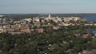 5.7K aerial stock footage fly away from and by the capitol dome and downtown seen from homes, Madison, Wisconsin Aerial Stock Footage | DX0002_161_006