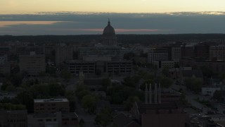 5.7K aerial stock footage of flying away from the capitol dome at sunset, Madison, Wisconsin Aerial Stock Footage | DX0002_162_001