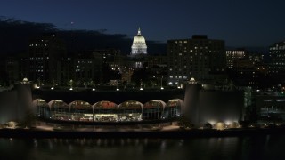 DX0002_162_028 - 5.7K aerial stock footage a view of capitol dome from the convention center at twilight, Madison, Wisconsin