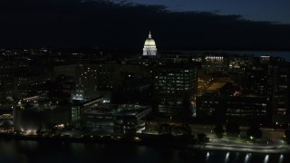 5.7K aerial stock footage ascend away from capitol dome and downtown buildings at twilight, Madison, Wisconsin Aerial Stock Footage | DX0002_162_029