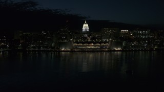 DX0002_162_039 - 5.7K aerial stock footage descend toward the convention center and capitol in downtown at night, Madison, Wisconsin