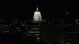 DX0002_162_042 - 5.7K aerial stock footage orbiting the capital dome at night, Madison, Wisconsin