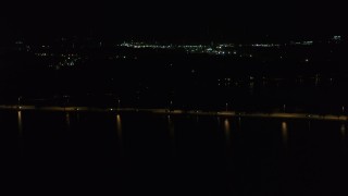 5.7K aerial stock footage of light traffic on a causeway on the lake at night, Madison, Wisconsin Aerial Stock Footage | DX0002_162_056