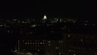 5.7K aerial stock footage ascend by hospital at night while focused on capitol, Madison, Wisconsin Aerial Stock Footage | DX0002_163_015