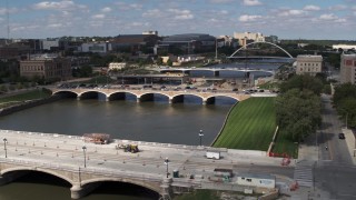 DX0002_165_009 - 5.7K aerial stock footage of three bridges spanning the river in Des Moines, Iowa