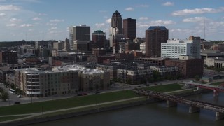 5.7K aerial stock footage slow orbit of hotels and apartment complex, reveal skyline of Downtown Des Moines, Iowa Aerial Stock Footage | DX0002_165_015