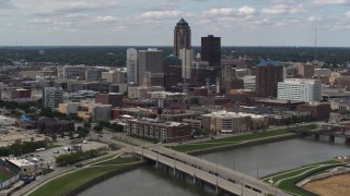 DX0002_165_021 - 5.7K aerial stock footage of the city's skyline seen from a bridge over the river, Downtown Des Moines, Iowa