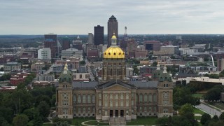 5.7K aerial stock footage of flying by the Iowa State Capitol with a view of the Downtown Des Moines, Iowa skyline Aerial Stock Footage | DX0002_166_006