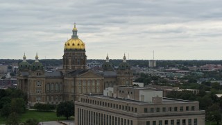 5.7K aerial stock footage ascend by government office building for view of the Iowa State Capitol, Des Moines, Iowa Aerial Stock Footage | DX0002_166_014