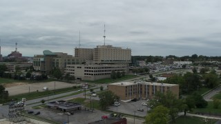 DX0002_166_042 - 5.7K aerial stock footage of orbiting a hospital in Des Moines, Iowa