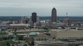 DX0002_167_003 - 5.7K aerial stock footage of a reverse view of the city's skyline and skyscraper in Downtown Des Moines, Iowa, reveal hospital