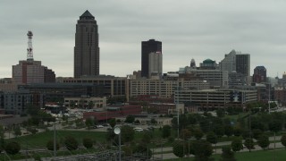 DX0002_167_016 - 5.7K aerial stock footage of a towering skyscraper and office buildings in Downtown Des Moines, Iowa