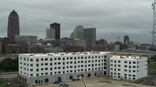 DX0002_167_030 - 5.7K aerial stock footage office buildings near the skyscraper in Downtown Des Moines, Iowa, seen from construction