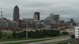 DX0002_167_031 - 5.7K aerial stock footage ascend and approach office buildings and skyscraper in Downtown Des Moines, Iowa