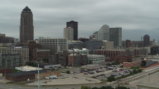 DX0002_167_032 - 5.7K aerial stock footage fly away from office buildings and a skyscraper in Downtown Des Moines, Iowa