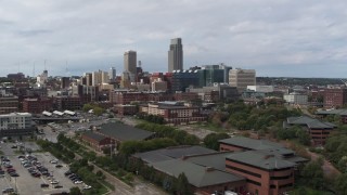 5.7K aerial stock footage of flying away from the city's skyline in Downtown Omaha, Nebraska Aerial Stock Footage | DX0002_168_003