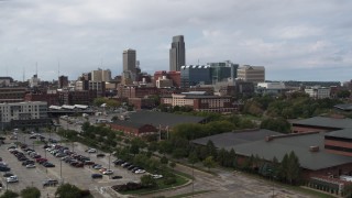 5.7K aerial stock footage descend with view of the downtown skyline in Downtown Omaha, Nebraska Aerial Stock Footage | DX0002_168_007