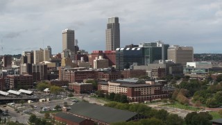 5.7K aerial stock footage of passing by skyscraper and downtown skyline in Downtown Omaha, Nebraska Aerial Stock Footage | DX0002_168_010