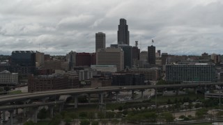 DX0002_168_015 - 5.7K aerial stock footage flyby and away from the city skyline, seen from the river, Downtown Omaha, Nebraska