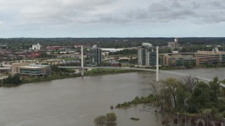 DX0002_168_020 - 5.7K aerial stock footage of a pedestrian bridge spanning the Missouri River, Omaha, Nebraska