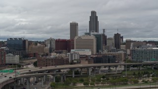 5.7K aerial stock footage of passing a riverfront park with a view of skyline, Downtown Omaha, Nebraska Aerial Stock Footage | DX0002_169_003