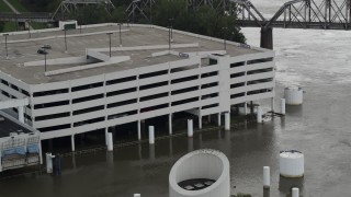 DX0002_169_015 - 5.7K aerial stock footage of circling a flooded parking garage in Council Bluffs, Iowa