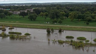 DX0002_169_041 - 5.7K aerial stock footage of circling a flooded parking lot in Council Bluffs, Iowa