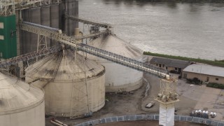 DX0002_170_006 - 5.7K aerial stock footage fly away from storage tanks and grain elevator in Council Bluffs, Iowa