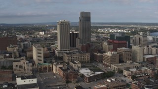 5.7K aerial stock footage of orbiting skyscrapers towering over city buildings in Downtown Omaha, Nebraska Aerial Stock Footage | DX0002_170_023