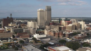 DX0002_170_027 - 5.7K aerial stock footage pass skyscrapers towering over city buildings in Downtown Omaha, Nebraska