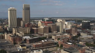 DX0002_170_028 - 5.7K aerial stock footage orbit office buildings near skyscrapers in Downtown Omaha, Nebraska