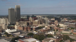 DX0002_170_029 - 5.7K aerial stock footage of circling office buildings near skyscrapers in Downtown Omaha, Nebraska