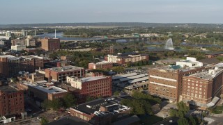 5.7K aerial stock footage fountain and park by river seen from office buildings, Downtown Omaha, Nebraska Aerial Stock Footage | DX0002_170_045