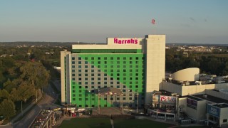 5.7K aerial stock footage of a reverse view of the hotel and casino at sunset in Council Bluffs, Iowa Aerial Stock Footage | DX0002_172_003