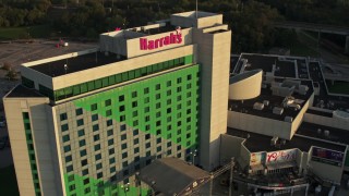 5.7K aerial stock footage fly away from the hotel and casino at sunset, Council Bluffs, Iowa Aerial Stock Footage | DX0002_172_005