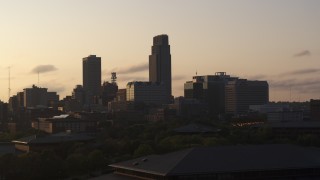 5.7K aerial stock footage approach and flyby skyscraper and skyline at sunset, Downtown Omaha, Nebraska Aerial Stock Footage | DX0002_172_012