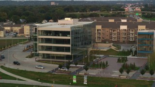 5.7K aerial stock footage of orbiting a modern office building at sunset in Council Bluffs, Iowa Aerial Stock Footage | DX0002_172_033