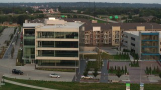 5.7K aerial stock footage of circling a modern office building at sunset in Council Bluffs, Iowa Aerial Stock Footage | DX0002_172_034