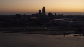 5.7K aerial stock footage reverse view of the skyline, arena and convention center at twilight, Downtown Omaha, Nebraska Aerial Stock Footage | DX0002_172_039