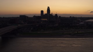 5.7K aerial stock footage of a reverse view of the skyline at twilight, Downtown Omaha, Nebraska Aerial Stock Footage | DX0002_172_041