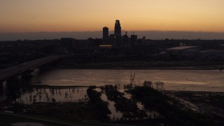 5.7K aerial stock footage of the skyline seen from bridge over the river at twilight, Downtown Omaha, Nebraska Aerial Stock Footage | DX0002_172_042