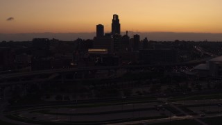 5.7K aerial stock footage of flying away from the skyline at twilight, Downtown Omaha, Nebraska Aerial Stock Footage | DX0002_172_046