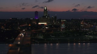 5.7K aerial stock footage of a view of the city's skyline at twilight, seen from the river, Downtown Omaha, Nebraska Aerial Stock Footage | DX0002_173_010