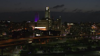 5.7K aerial stock footage fly away from the city's skyline at twilight, seen from river, Downtown Omaha, Nebraska Aerial Stock Footage | DX0002_173_019