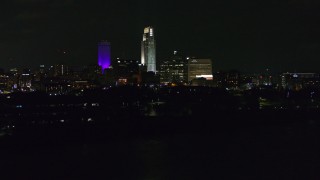 DX0002_173_042 - 5.7K aerial stock footage of tall skyscrapers at night, Downtown Omaha, Nebraska