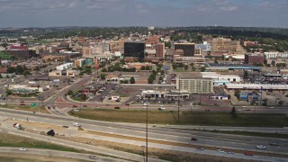 DX0002_174_012 - 5.7K aerial stock footage ascending with a view of office buildings in Downtown Sioux City, Iowa