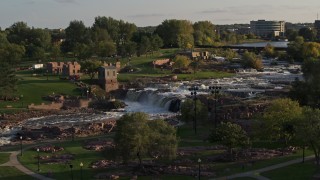 5.7K aerial stock footage of the falls at Falls Park at sunset in Sioux Falls, South Dakota Aerial Stock Footage | DX0002_176_001