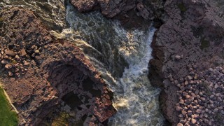 5.7K aerial stock footage a bird's eye view of rapids on the river at sunset in Sioux Falls, South Dakota Aerial Stock Footage | DX0002_176_017