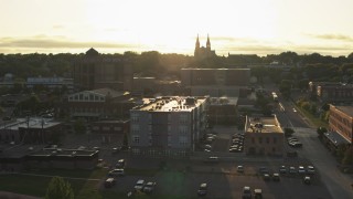 DX0002_176_029 - 5.7K aerial stock footage flyby apartment, county office buildings, cathedral at sunset in Downtown Sioux Falls, South Dakota